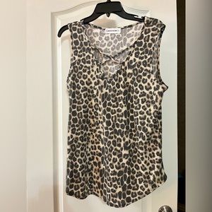 Leopard sleeveless top with cross detailed neck line